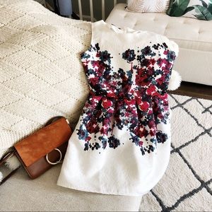 white dress with floral patterns